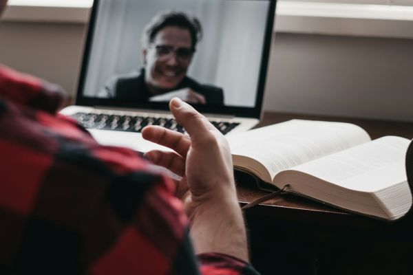 Man using laptop for one on one video call